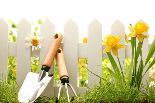 Garden maintenance in Coombe with neatly trimmed lawn and borders