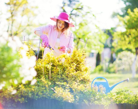 Gardener carrying out a site safety check before work