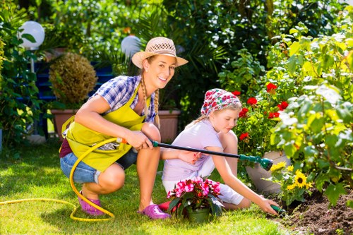 Garden maintenance booking and quotation paperwork on a clipboard